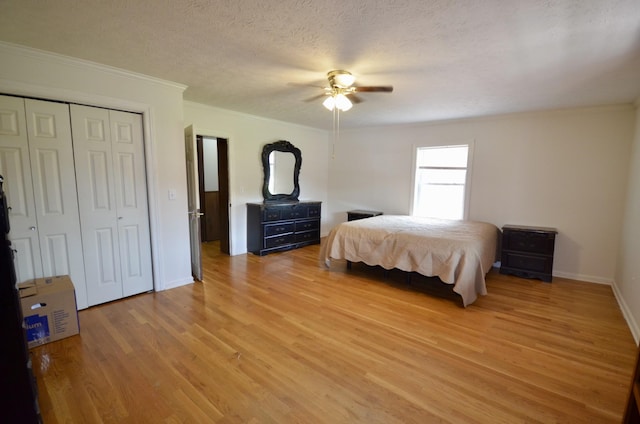 1355 Westfield Rd, Dickson, TN 37055 - bedroom with light wood-style flooring, crown molding, a ceiling fan, a closet, and a textured ceiling