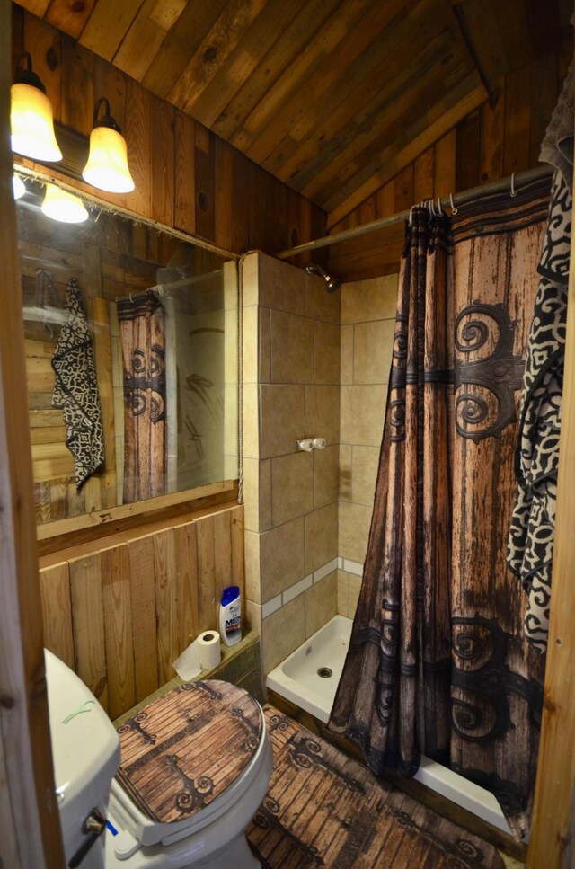 1355 Westfield Rd, Dickson, TN 37055 - bathroom with a stall shower, lofted ceiling, wooden ceiling, and wooden walls
