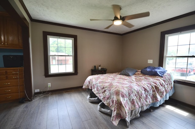 1355 Westfield Rd, Dickson, TN 37055 - bedroom featuring a textured ceiling, wood finished floors, crown molding, and ceiling fan