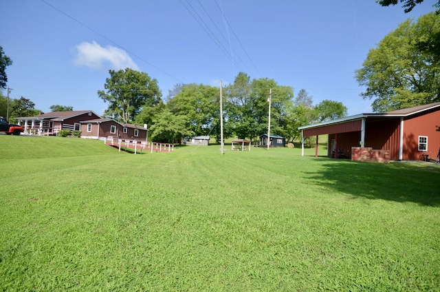 1355 Westfield Rd, Dickson, TN 37055 - view of grassy yard featuring an outdoor structure and an outbuilding