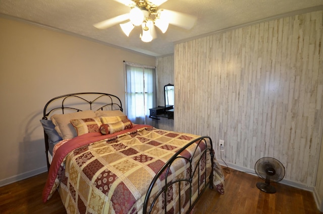 1355 Westfield Rd, Dickson, TN 37055 - bedroom featuring wood finished floors, wooden walls, a ceiling fan, and crown molding