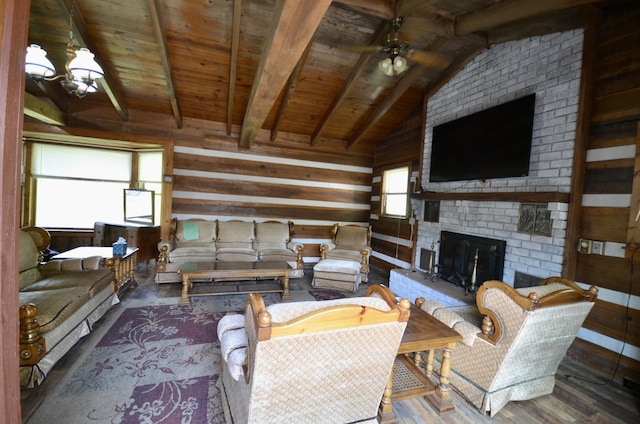 1355 Westfield Rd, Dickson, TN 37055 - living room with wood finished floors, wood ceiling, wood walls, a brick fireplace, and a chandelier