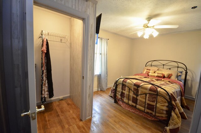 1355 Westfield Rd, Dickson, TN 37055 - bedroom with wood finished floors, ornamental molding, a ceiling fan, and a textured ceiling