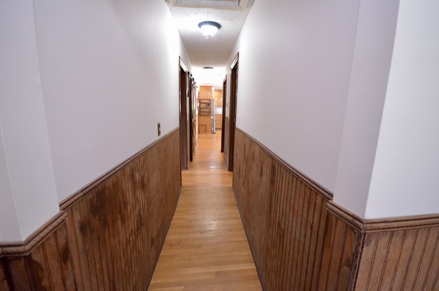 1355 Westfield Rd, Dickson, TN 37055 - hallway with a wainscoted wall, attic access, light wood finished floors, and wooden walls