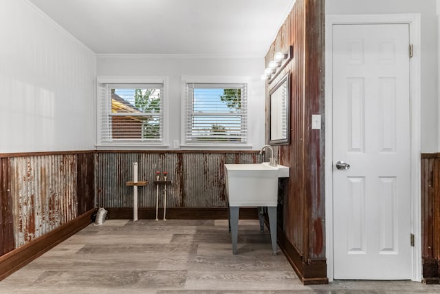 1200 Mill St, Pulaski, TN 38478 - bathroom featuring crown molding, wood finished floors, wainscoting, and wooden walls
