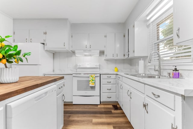 1200 Mill St, Pulaski, TN 38478 - kitchen with white appliances, under cabinet range hood, white cabinetry, and dark wood-style floors