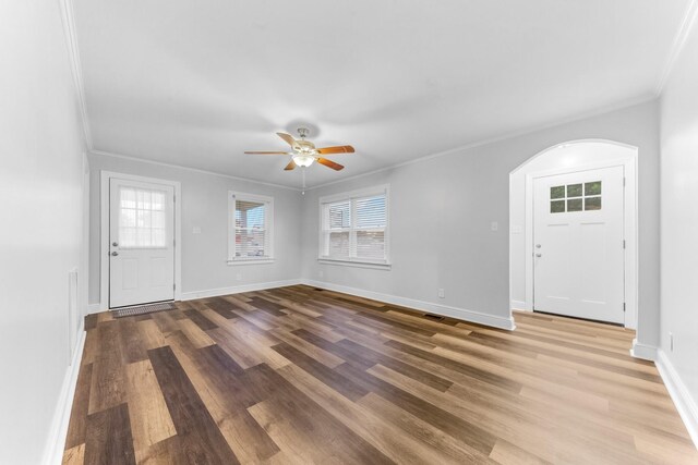 1200 Mill St, Pulaski, TN 38478 - entryway featuring plenty of natural light, ornamental molding, a ceiling fan, wood finished floors, and arched walkways