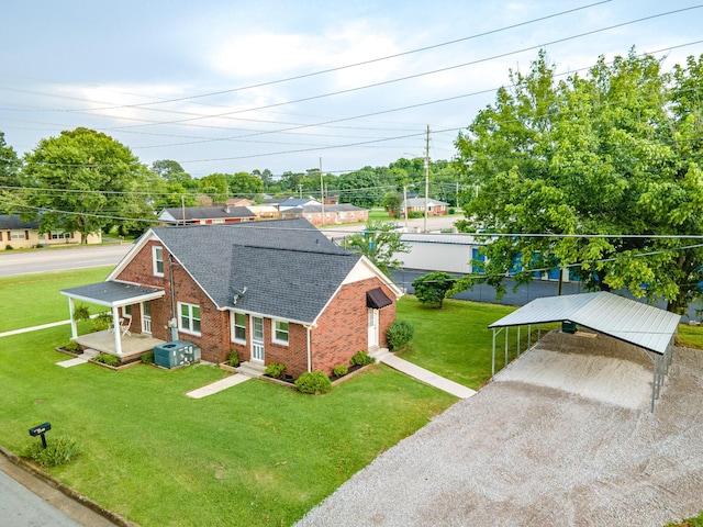 1200 Mill St, Pulaski, TN 38478 - view of front of property featuring brick siding, a shingled roof, a carport, a front yard, and driveway