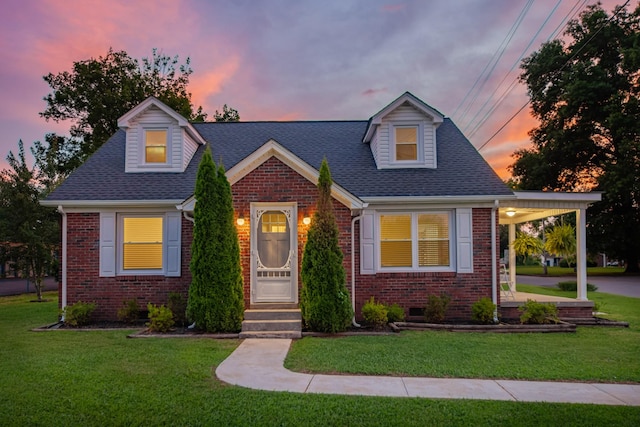 1200 Mill St, Pulaski, TN 38478 - cape cod house featuring brick siding, a front lawn, and roof with shingles