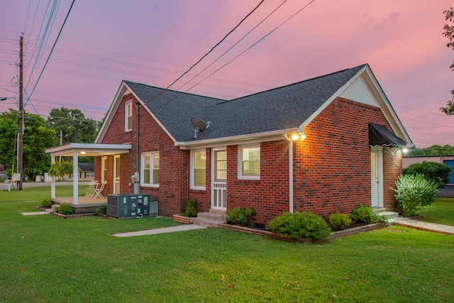 1200 Mill St, Pulaski, TN 38478 - view of front of home featuring brick siding, a lawn, entry steps, and a shingled roof