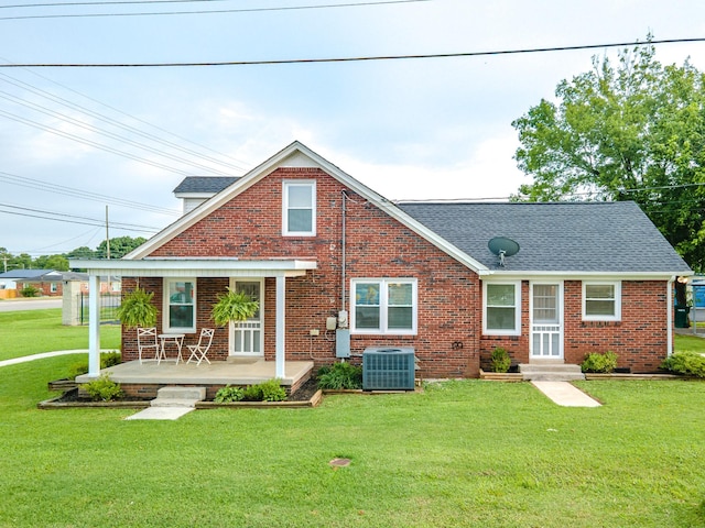 1200 Mill St, Pulaski, TN 38478 - view of front of property with brick siding, a front lawn, and a shingled roof
