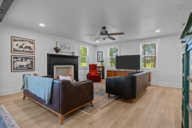 1030 Upper Creek Rd, Vanleer, TN 37181 - living area featuring a fireplace, recessed lighting, ceiling fan, and light wood-style flooring