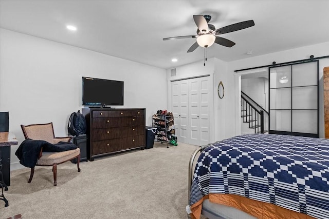 1030 Upper Creek Rd, Vanleer, TN 37181 - bedroom featuring a barn door, carpet floors, a closet, a ceiling fan, and recessed lighting