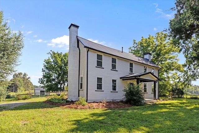 1030 Upper Creek Rd, Vanleer, TN 37181 - rear view of house featuring a chimney and a metal roof
