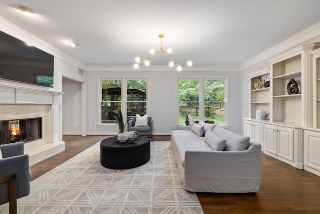 7075 Willowick Dr, Brentwood, TN 37027 - living area featuring a chandelier, crown molding, a fireplace, and wood finished floors