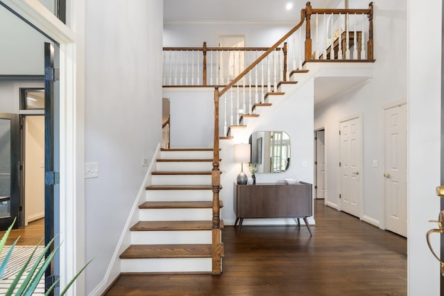 7075 Willowick Dr, Brentwood, TN 37027 - stairs featuring ornamental molding, wood finished floors, and a towering ceiling