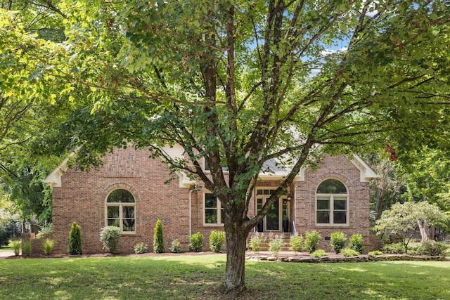 7075 Willowick Dr, Brentwood, TN 37027 - obstructed view of property with brick siding and a front yard