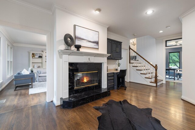7075 Willowick Dr, Brentwood, TN 37027 - living area with stairs, dark wood-style floors, a fireplace, crown molding, and recessed lighting