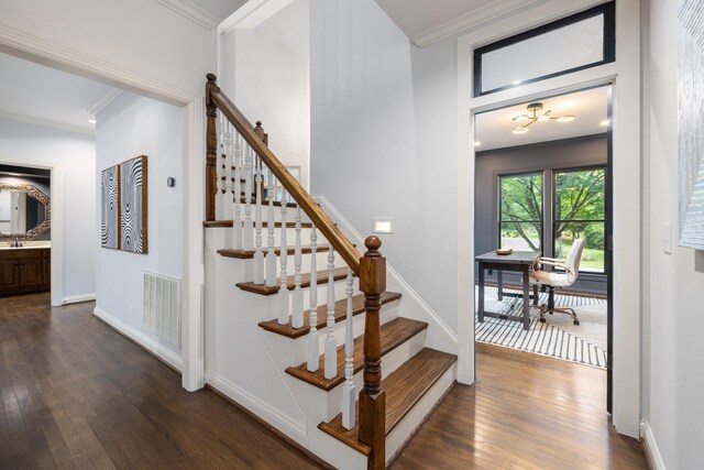 7075 Willowick Dr, Brentwood, TN 37027 - staircase with ornamental molding and wood finished floors