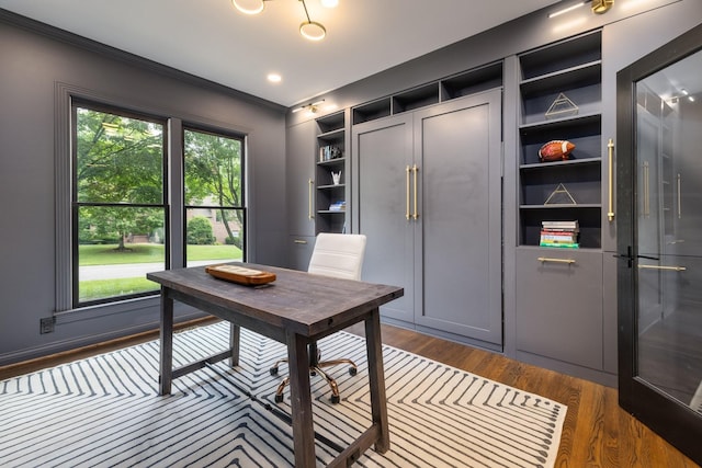7075 Willowick Dr, Brentwood, TN 37027 - home office with crown molding, dark wood finished floors, and built in shelves
