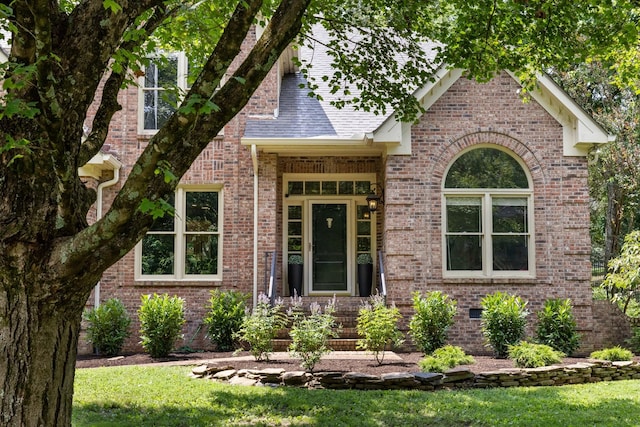 7075 Willowick Dr, Brentwood, TN 37027 - view of front of home featuring brick siding, a front yard, and roof with shingles