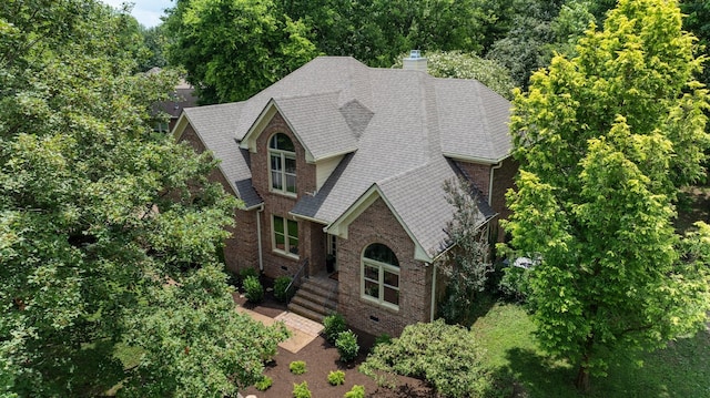7075 Willowick Dr, Brentwood, TN 37027 - view of front of home with roof with shingles, a chimney, and brick siding
