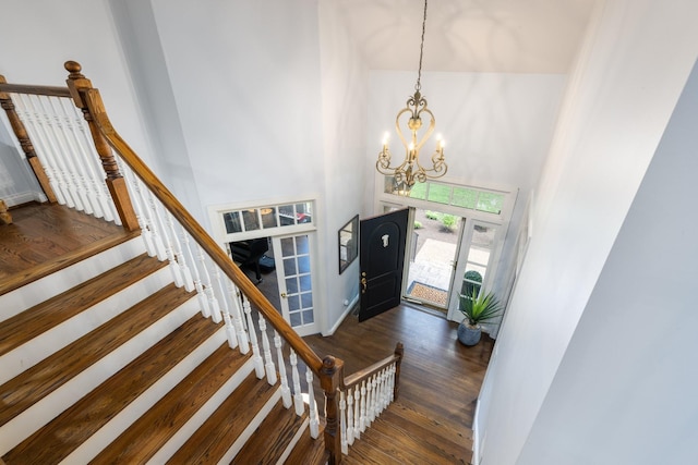 7075 Willowick Dr, Brentwood, TN 37027 - entryway featuring a chandelier, wood finished floors, a towering ceiling, and stairs