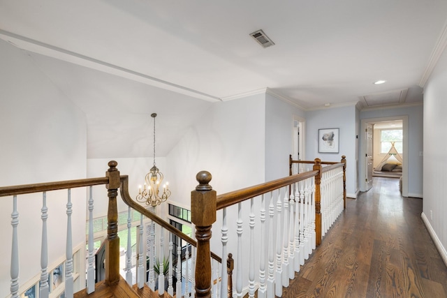 7075 Willowick Dr, Brentwood, TN 37027 - hallway featuring an upstairs landing, attic access, wood finished floors, crown molding, and a chandelier