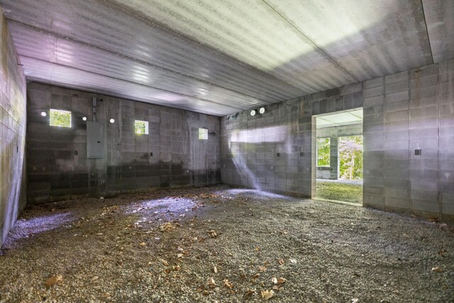 432 Slow Roll Dr, Chapmansboro, TN 37035 - spare room with concrete block wall, healthy amount of natural light, and electric panel