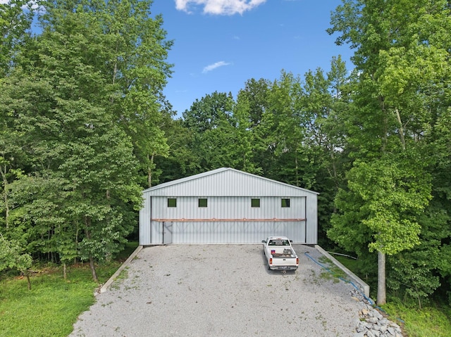 432 Slow Roll Dr, Chapmansboro, TN 37035 - view of front of home with a detached garage and an outbuilding
