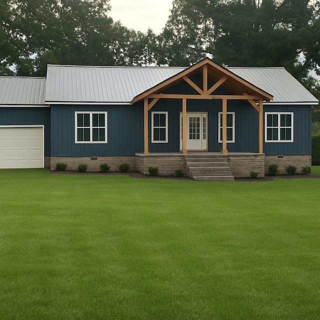1166 Dugout Rd, Summertown, TN 38483 - view of front of property featuring a porch, a front lawn, a garage, and a metal roof