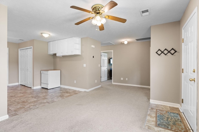 7215 Horn Tavern Rd, Fairview, TN 37062 - spare room featuring attic access, a ceiling fan, and light colored carpet