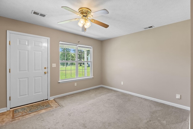 7215 Horn Tavern Rd, Fairview, TN 37062 - entryway with carpet flooring, a ceiling fan, and a textured ceiling