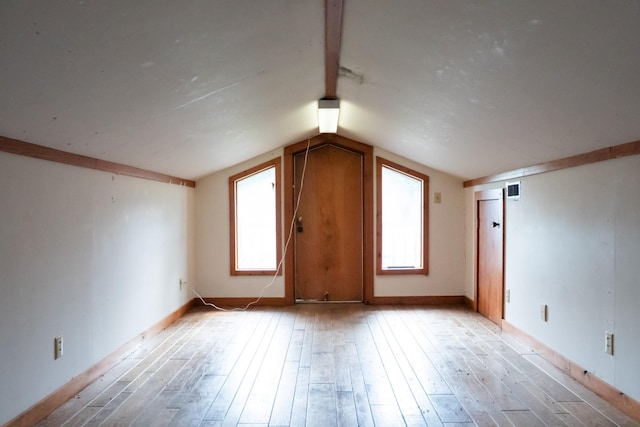 7030 Dodson Branch Rd, Cookeville, TN 38501 - additional living space with light wood-style floors, lofted ceiling, and healthy amount of natural light