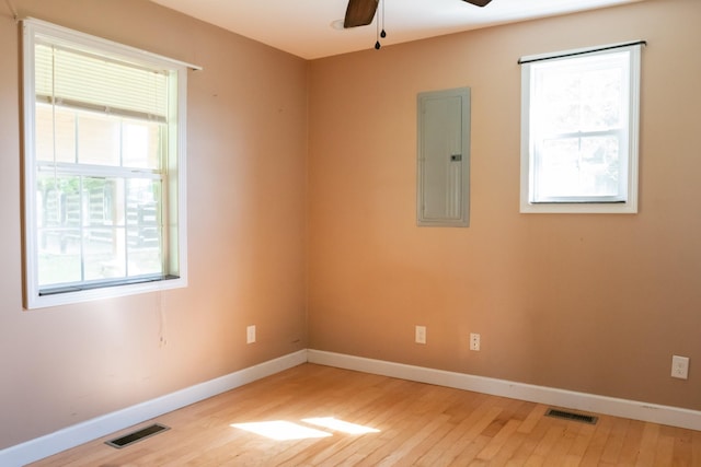 7030 Dodson Branch Rd, Cookeville, TN 38501 - spare room with electric panel, light wood finished floors, and ceiling fan