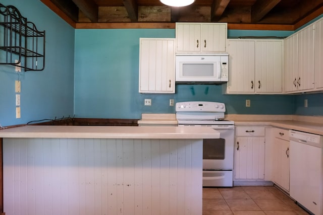7030 Dodson Branch Rd, Cookeville, TN 38501 - kitchen featuring white appliances, light countertops, beamed ceiling, light tile patterned floors, and white cabinetry