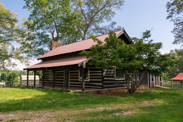 7030 Dodson Branch Rd, Cookeville, TN 38501 - view of home's exterior featuring a metal roof and a chimney