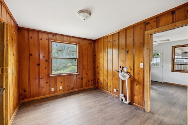 1421 Lakeview Rd, Clarksville, TN 37040 - empty room featuring wood finished floors, wood walls, and a ceiling fan