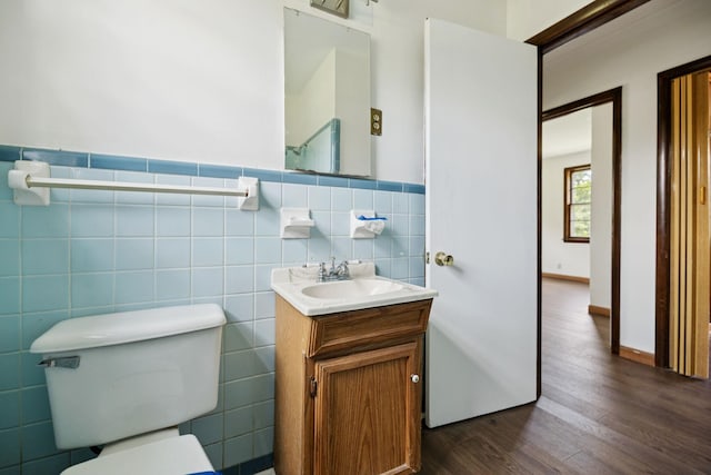 1421 Lakeview Rd, Clarksville, TN 37040 - bathroom featuring wood finished floors, vanity, tile walls, and wainscoting