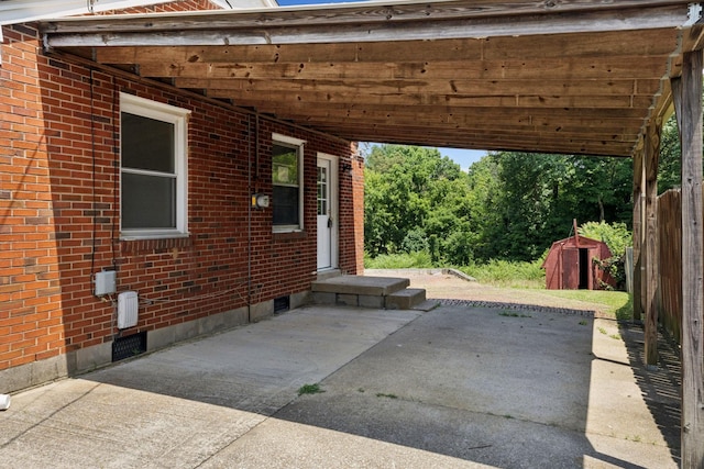 1421 Lakeview Rd, Clarksville, TN 37040 - view of patio featuring a storage shed and an attached carport