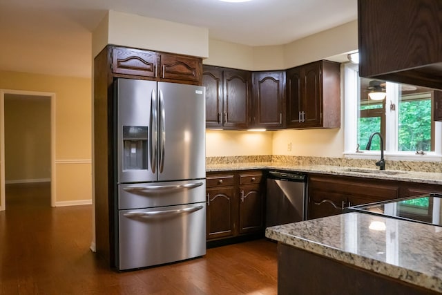 745 Contraband Ln, Cookeville, TN 38501 - kitchen featuring stainless steel appliances, dark brown cabinetry, and light stone countertops
