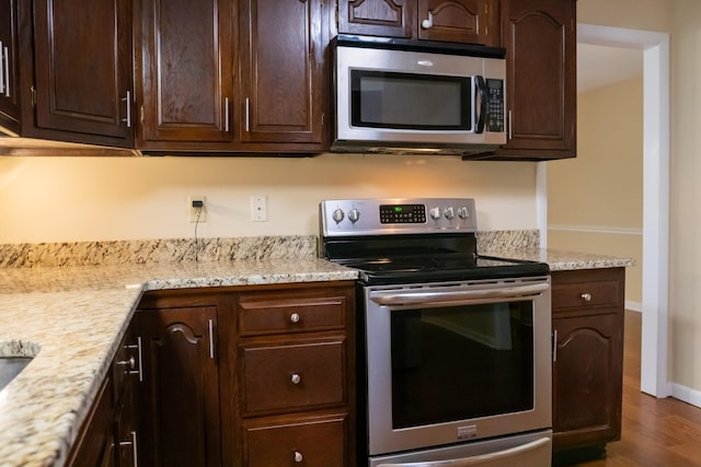 745 Contraband Ln, Cookeville, TN 38501 - kitchen with stainless steel appliances, dark brown cabinetry, and dark wood-style flooring