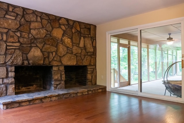 745 Contraband Ln, Cookeville, TN 38501 - unfurnished living room with a fireplace, wood finished floors, and a ceiling fan
