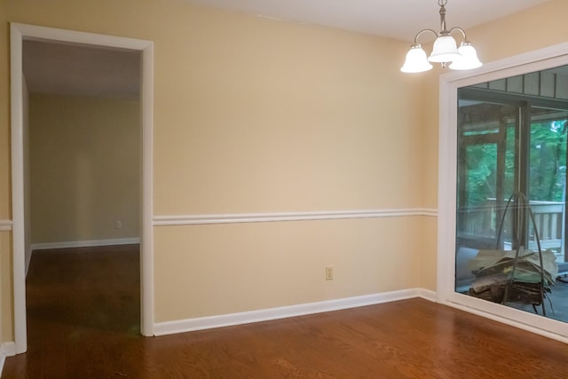 745 Contraband Ln, Cookeville, TN 38501 - unfurnished room featuring dark wood finished floors and a chandelier