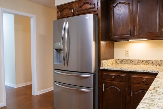 745 Contraband Ln, Cookeville, TN 38501 - kitchen with stainless steel fridge with ice dispenser, dark wood-type flooring, dark brown cabinets, and light stone counters