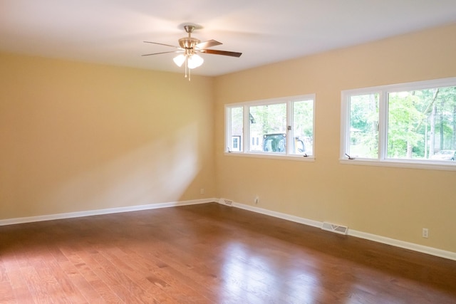 745 Contraband Ln, Cookeville, TN 38501 - unfurnished room featuring plenty of natural light, dark wood-style flooring, and a ceiling fan