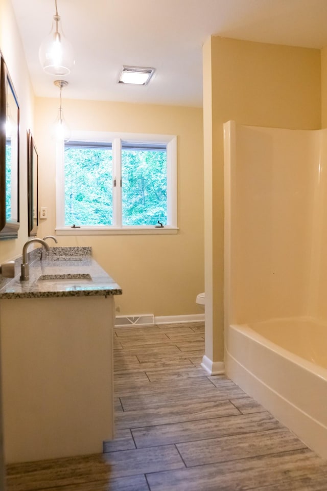 745 Contraband Ln, Cookeville, TN 38501 - full bathroom featuring double vanity, wood finished floors, and  shower combination