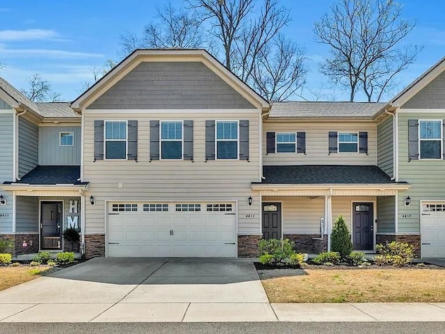 4437 Sunday Silence Way, Murfreesboro, TN 37128 - view of front of home with a garage, driveway, stone siding, and covered porch