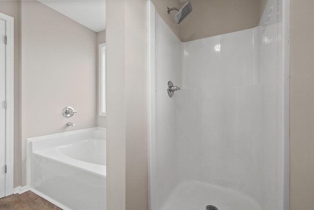 3798 Bret Dr, Clarksville, TN 37040 - full bath featuring a shower, a garden tub, and wood finished floors