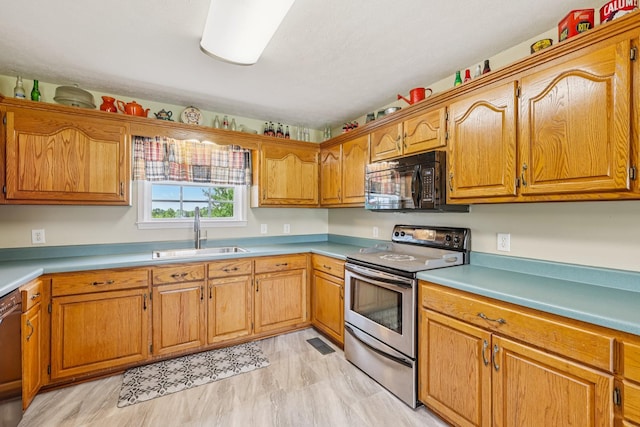 4505 Polaris Dr, Chapel Hill, TN 37034 - kitchen featuring stainless steel appliances, light countertops, and brown cabinetry